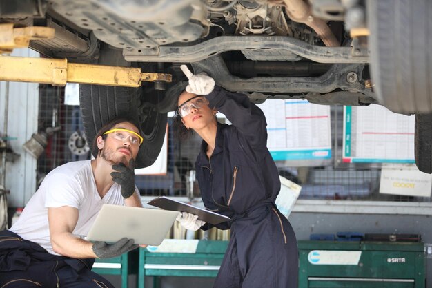 young-mechanics-working-garage